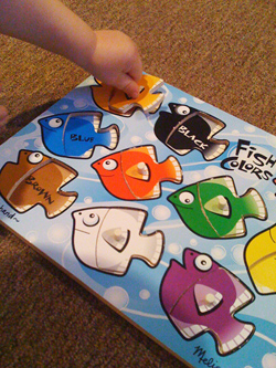 boy putting puzzle together